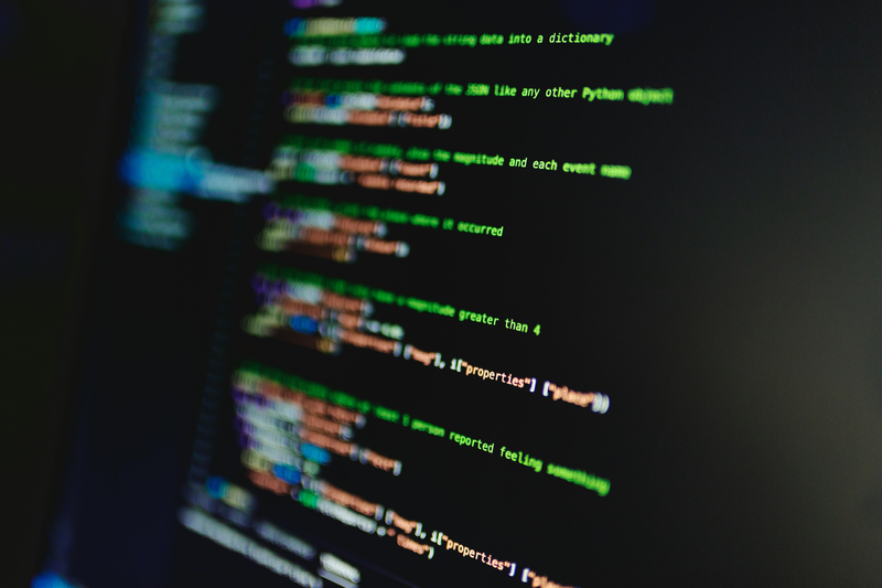 Coloured code streaming across the screen, illustrating syntax highlighting