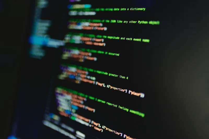Coloured code streaming across the screen, illustrating syntax highlighting